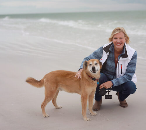 “Beachside Bliss: A Woman and Her Loyal Companion Embracing the Moment”